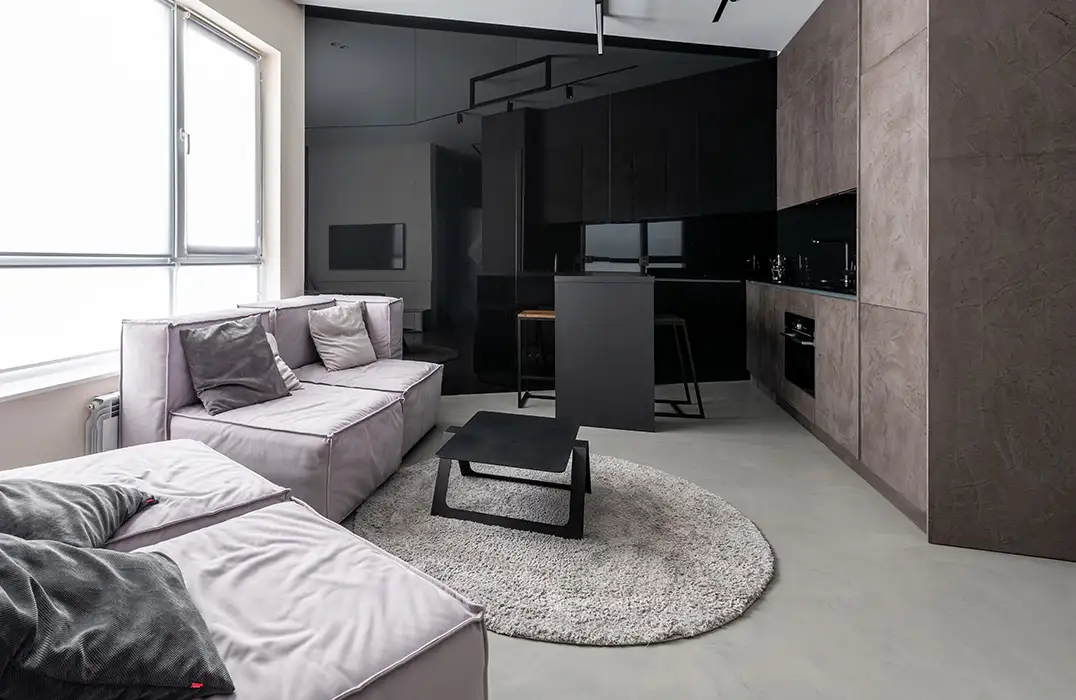 Kitchen open to the living room with polished concrete floor