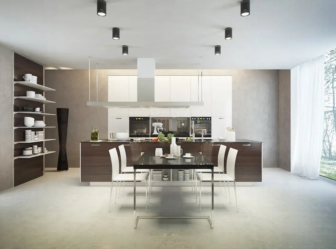 Bright kitchen with island in the middle and gray microcement underfloor heating application