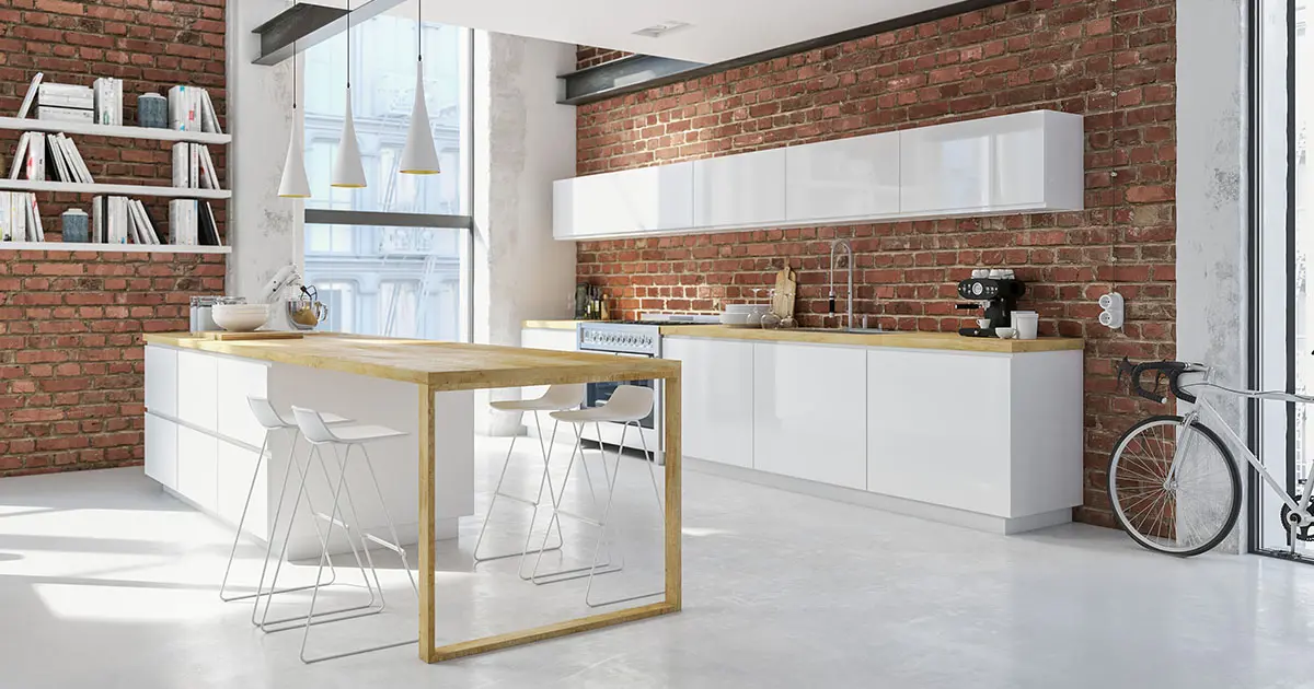 Microcement coating on the floor of an industrial-style kitchen