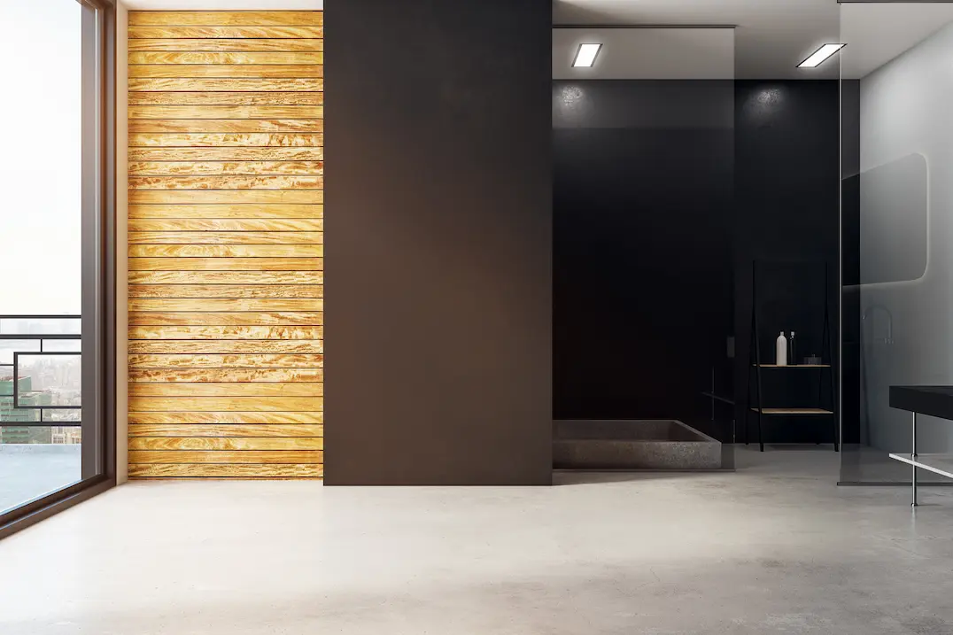 Baño moderno en dormitorio con suelo de microcemento en Bilbao