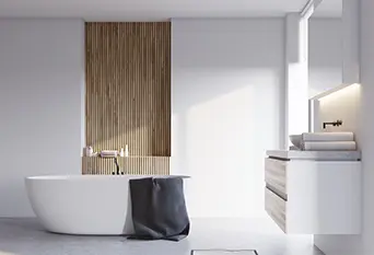 Mikrosementti kylpyhuone, joka on sisustettu minimalistisella tyylillä ja puun kosketuksilla