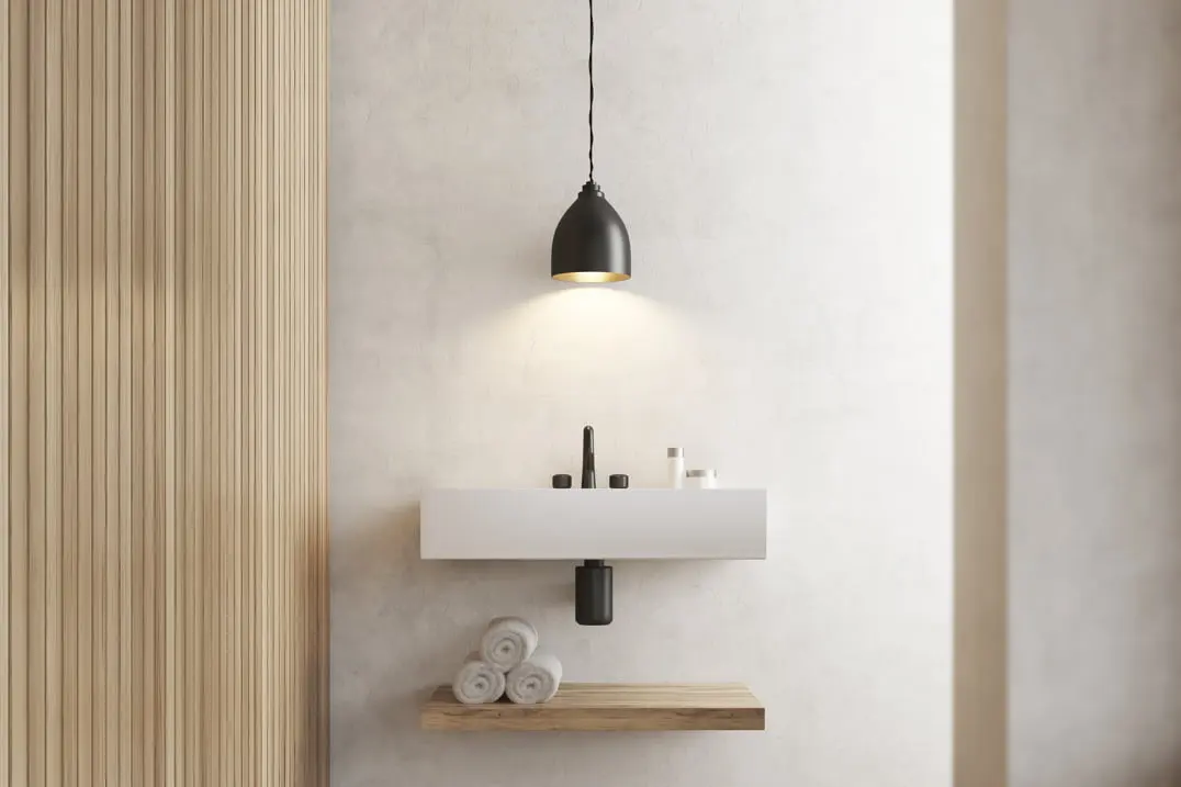 Mikrosementti minimalistisen kylpyhuoneen seinällä ja pesualtaalla
